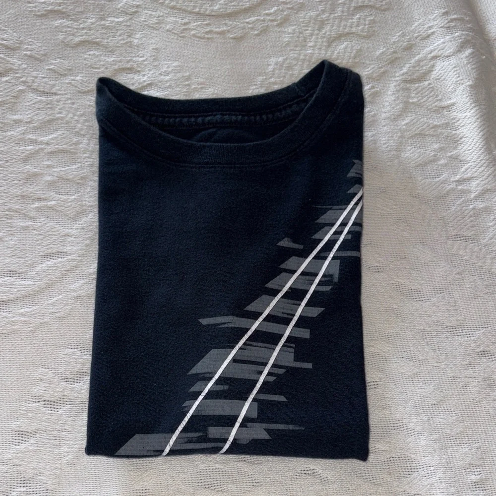 Gently loved Nike Kids Black T-Shirt with White Swoosh